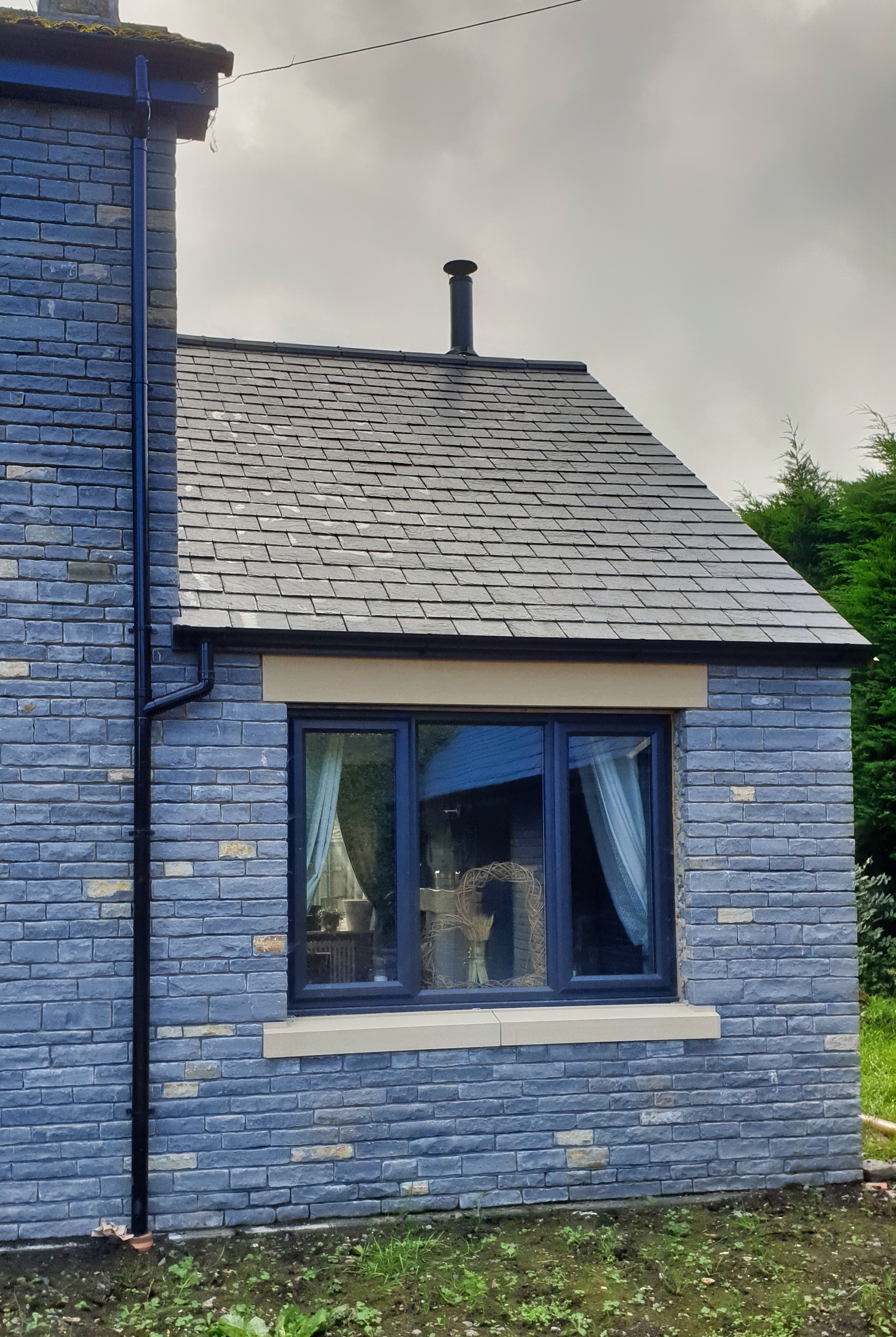 Blue Lias stone and slate roof, side extension.