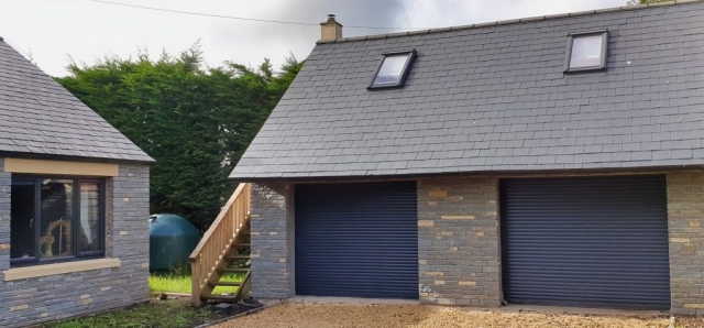 Blue Lias stone and slate roof, side extension and double garage.