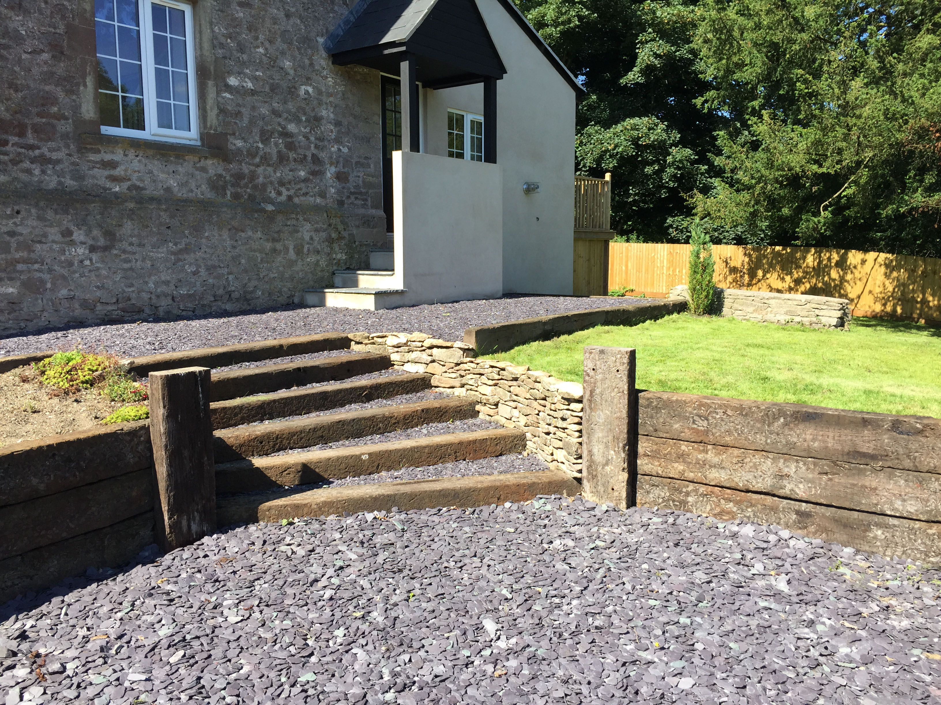Cottage renovation with rear extension and stone driveway
